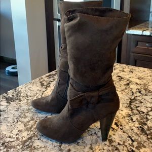 Dark brown mid calf boots.
